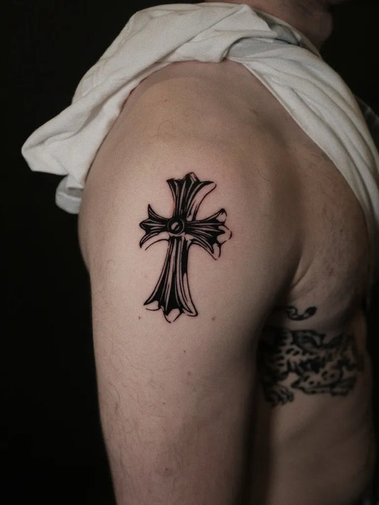 Small Blackwork Cross on Men Upper Arm Tattoo by @uk._.tt