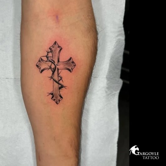Small Blackwork Cross with Barbed Wire on Men Arm Tattoo by @gargoyletattoostudio