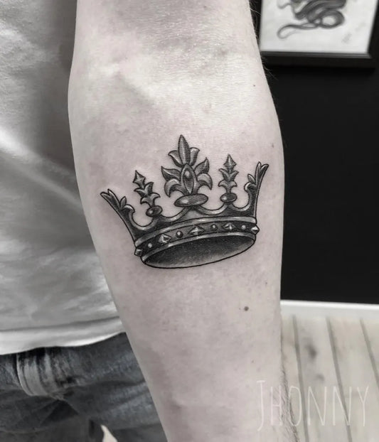 Small Blackwork Crown Tattoo on Men Forearm by @jhonnymtattoo
