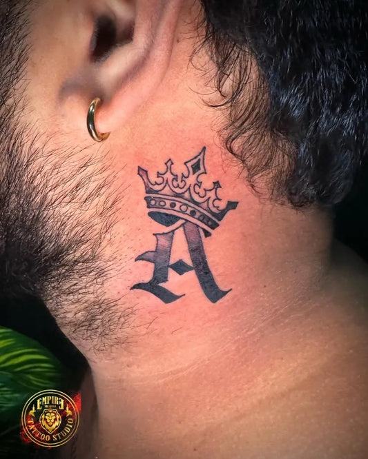 Small Blackwork Crown and A Tattoo on Men Neck by @empiretattoostudiosl