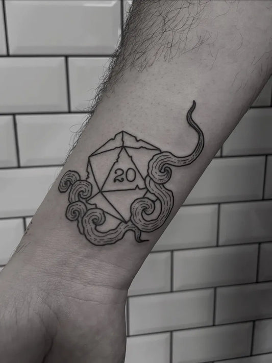 Small Blackwork D20 Dice with Tentacles Tattoo on Men Wrist by @alicecandy