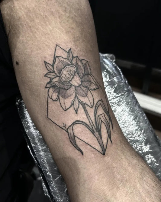 Small Blackwork Daffodil and Geometric Tattoo on Men Arm by @molliemactattoo