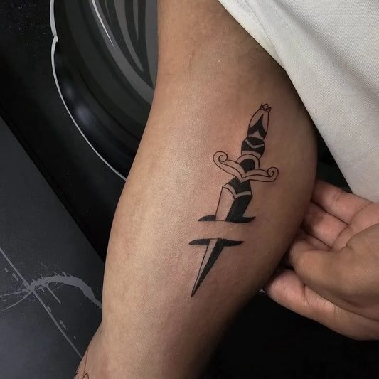 Small Blackwork Dagger Tattoo on Men Arm by @shinobi_ink_