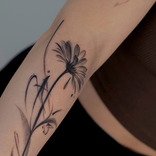 Small Blackwork Daisy and Stems Tattoo on Women Arm by @karmon.tat
