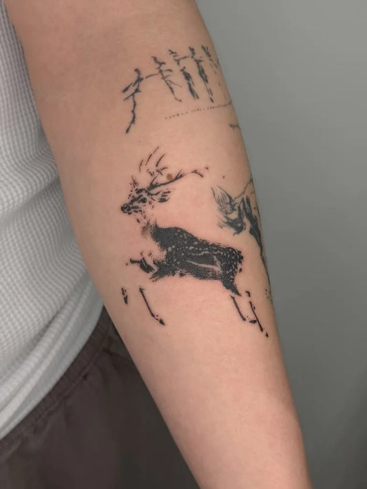 Small Blackwork Deer Tattoo on Women Arm by @leenie________boog