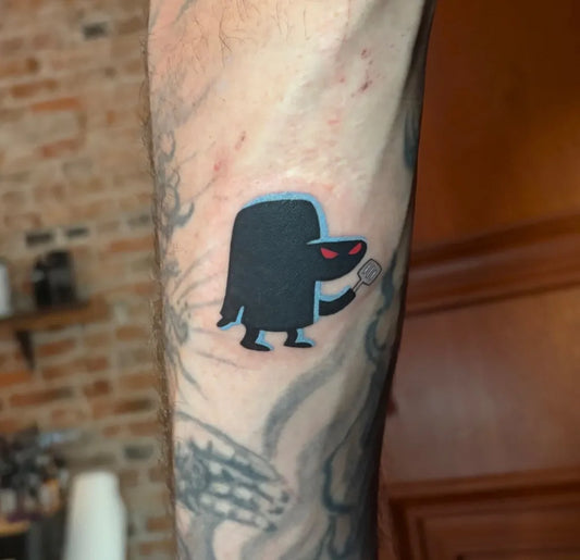 Small Blackwork Demon Figure Cartoon Tattoo on Men Arm by @aliciamarietattoo