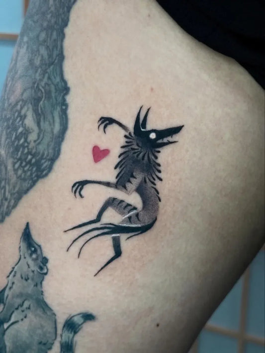 Small Blackwork Demon and Cat Tattoo on Women Thigh by @nythera.ink
