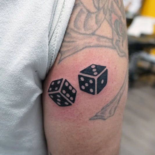 Small Blackwork Dice Tattoo on Men Arm by @endlessheightstattoo