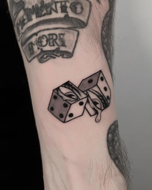Small Blackwork Dice Tattoo on Men Arm by @joshcoburntattoo