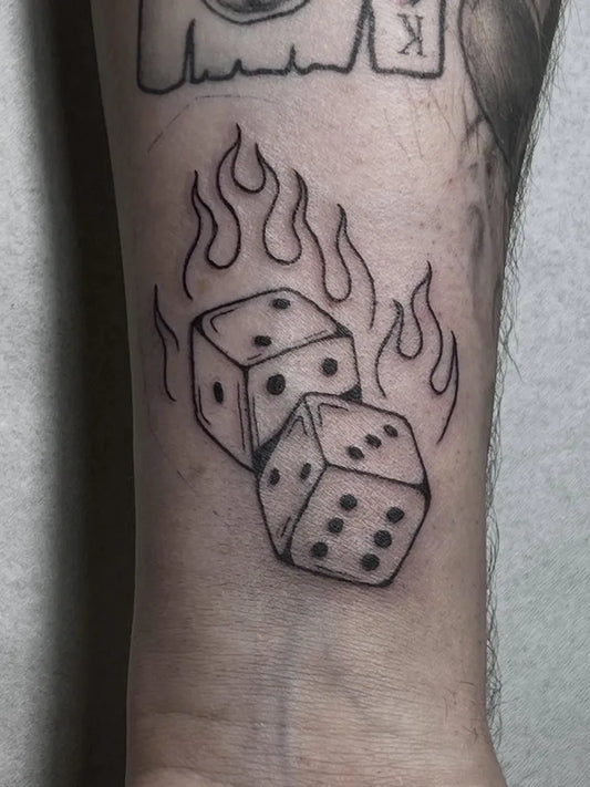 Small Blackwork Dice Tattoo on Men Wrist by @emppukettu_tattoo