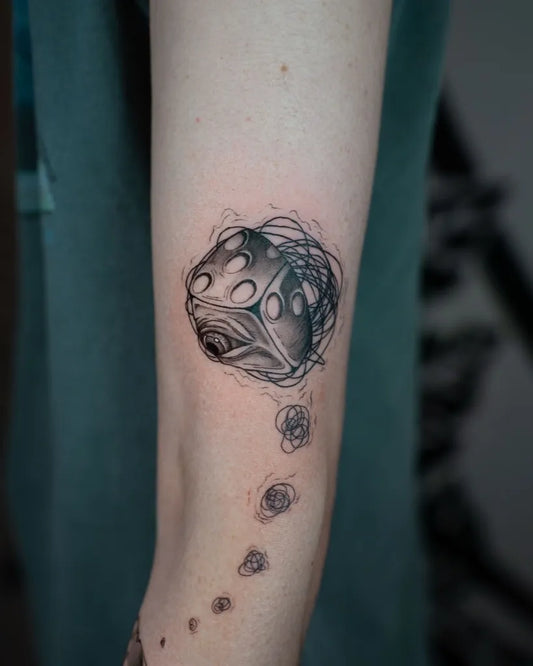 Small Blackwork Dice and Orbs Tattoo on Women Arm by @bl.ink_tattooer