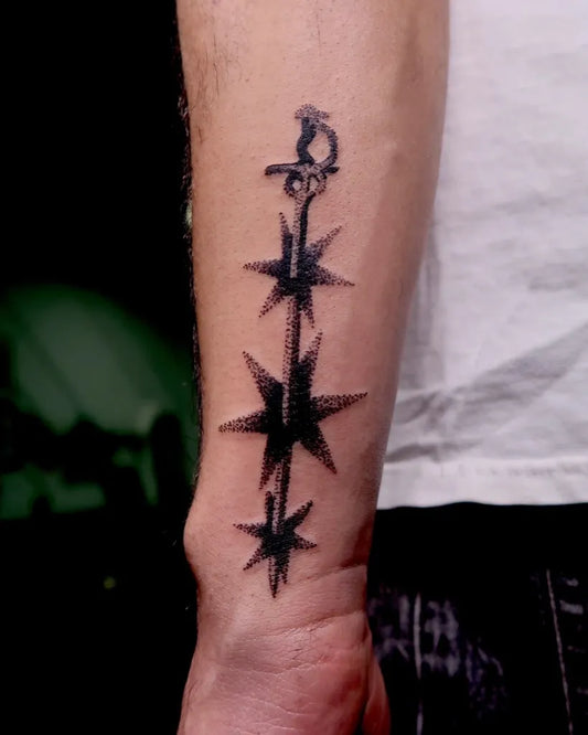 Small Blackwork Dotwork Star Chain Tattoo on Men Arm by @feelings_boi