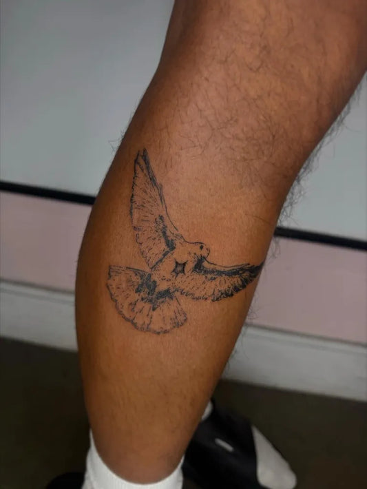 Small Blackwork Dove Tattoo on Men Leg by @p0melow