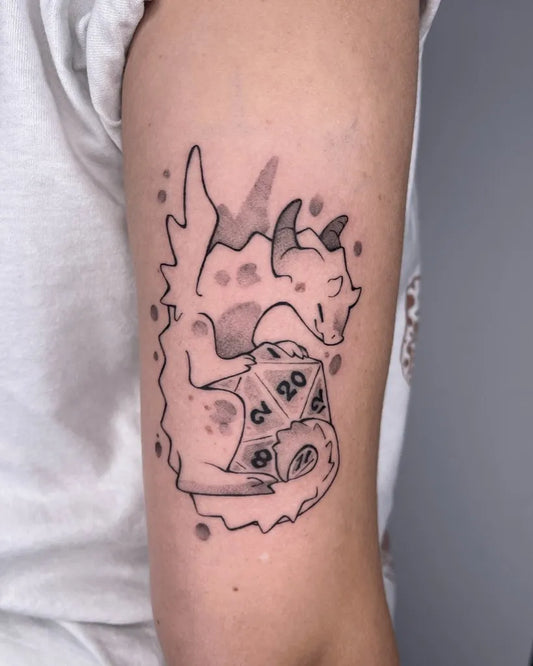 Small Blackwork Dragon and Dice Tattoo on Women Arm by @mortinfamia