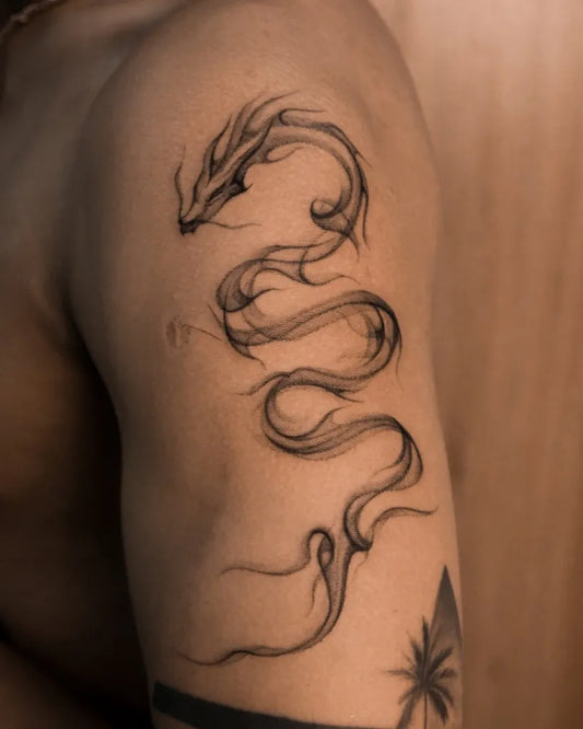 Small Blackwork Dragon on Men Shoulder Tattoo by @uncle.ti