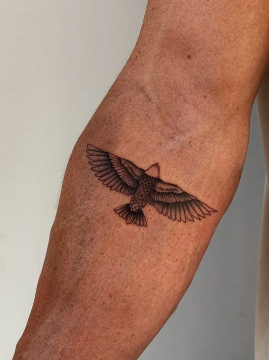Small Blackwork Eagle Tattoo on Men Arm by @lara.ink_