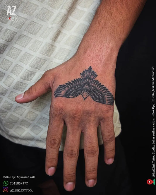Small Blackwork Eagle Tattoo on Men Hand by @az_ink_tattoo_