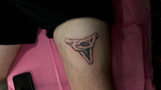 Small Blackwork Evil Eye on Men Thigh Tattoo by @inkedbykayks