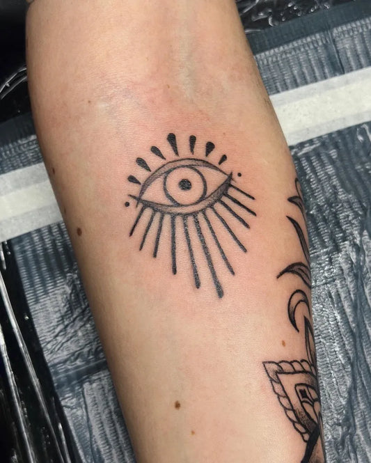 Small Blackwork Eye on Women Arm Tattoo by @calliedarresstattoos