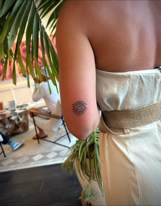 Small Blackwork Eye on Women Arm Tattoo by @montauktattoony