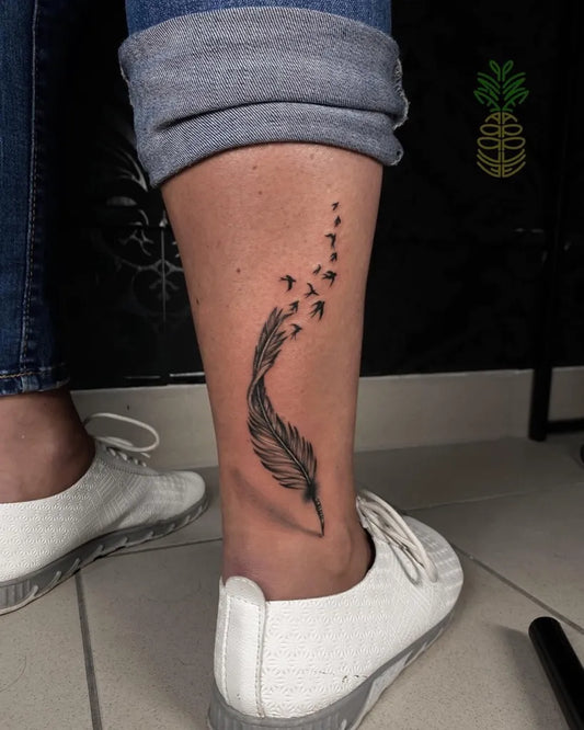 Small Blackwork Feather Tattoo on Women Leg by @tattoo_pineapple