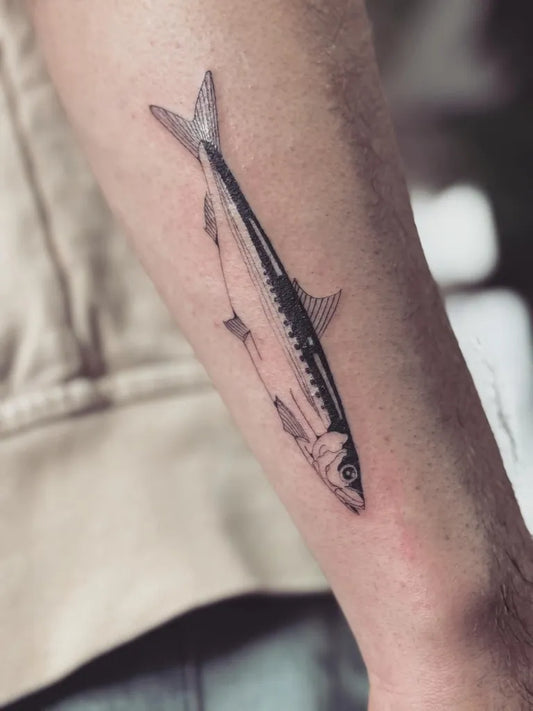Small Blackwork Fish Tattoo on Men Forearm by @macun.ttt
