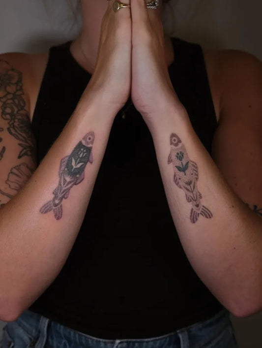 Small Blackwork Fish Tattoo on Women Arms by @poorthingdesigns