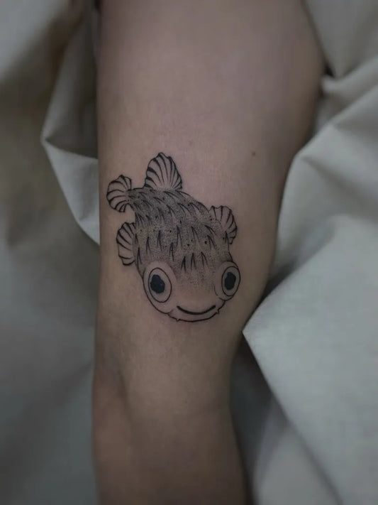 Small Blackwork Fish Tattoo on Women Thigh by @steffects.ink