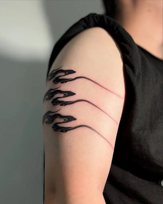 Small Blackwork Flames Cloud Tattoo on Men Arm by @biiu.tattoo