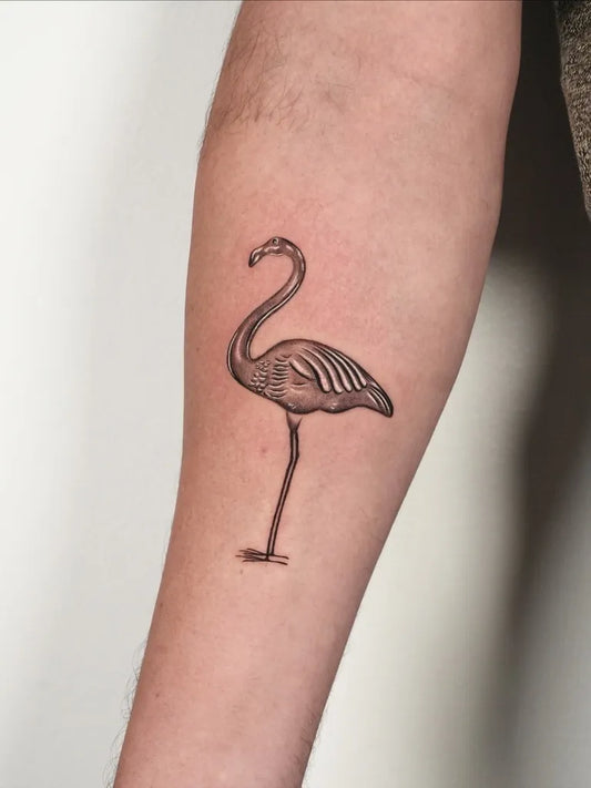 Small Blackwork Flamingo Tattoo on Men Arm by @eian.tatt