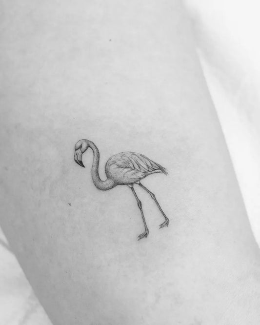 Small Blackwork Flamingo Tattoo on Women Arm by @bibi.abelle
