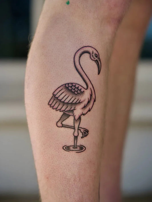 Small Blackwork Flamingo Tattoo on Women Leg by @jake.howse