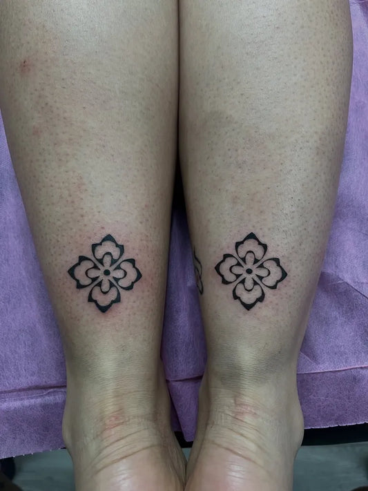 Small Blackwork Floral Mandala Tattoo on Women Legs by @brujitatattoos