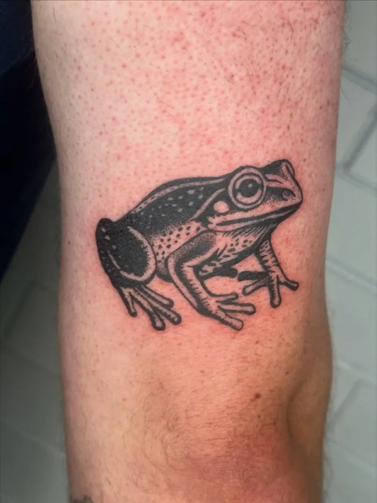 Small Blackwork Frog Tattoo on Men Arm by @stickaroundtattoo