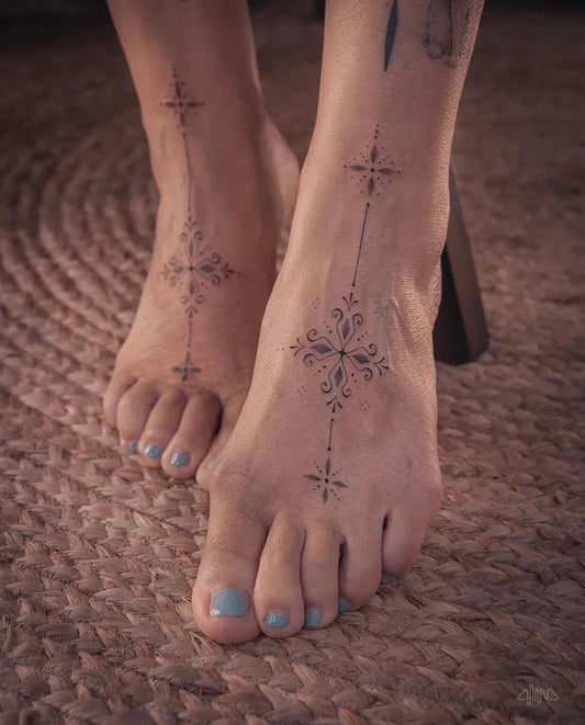 Small Blackwork Geometric Crosses Tattoo on Women Foot by @alinabaertattoo