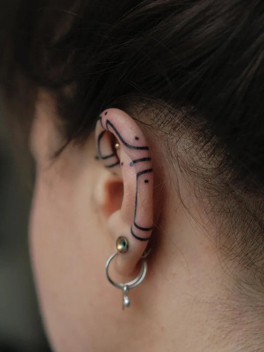 Small Blackwork Geometric Lines Tattoo on Women Behind the Ear by @rod.no.va