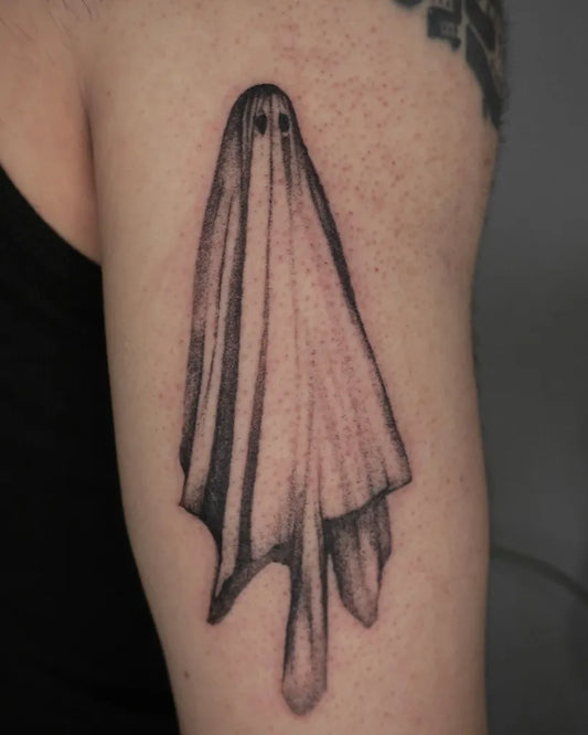 Small Blackwork Ghost Tattoo on Women Arm by @cowgurl_bebop