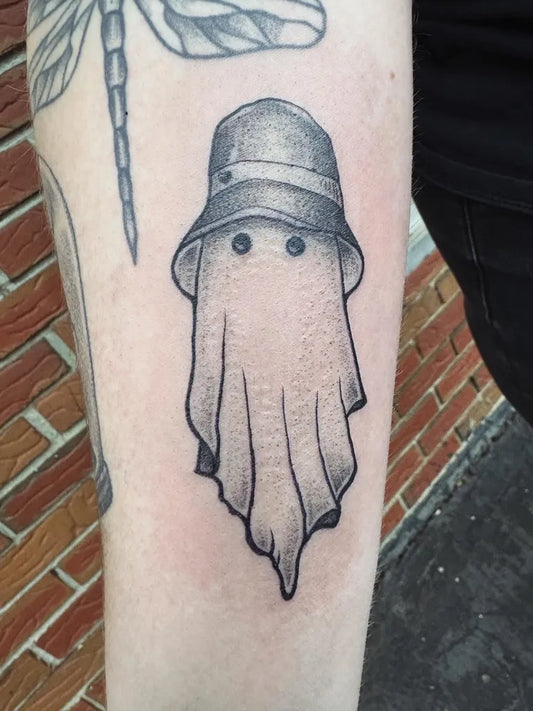 Small Blackwork Ghost in Hat Tattoo on Women Arm by @originalfakes