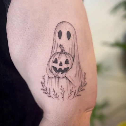 Small Blackwork Ghost with Pumpkin Tattoo on Women Arm by @finelinebaddie