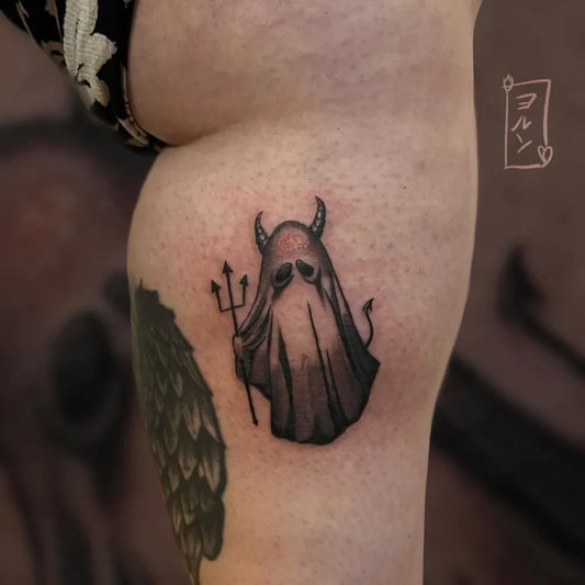 Small Blackwork Ghost with Trident Tattoo on Women Thigh by @jorun.ink