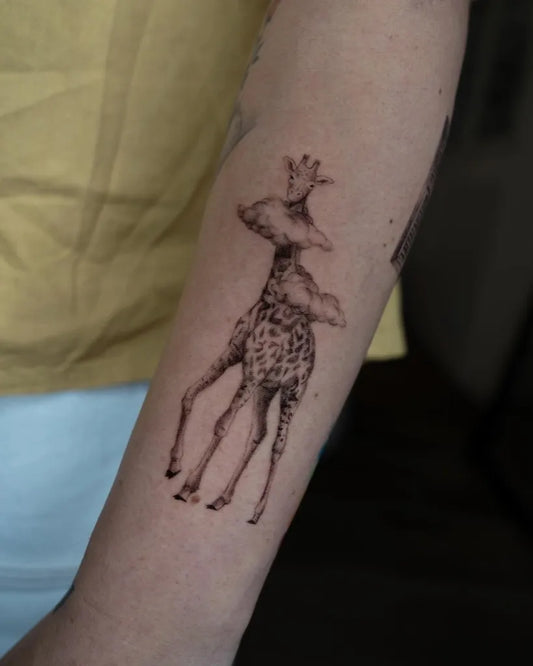 Small Blackwork Giraffe with Crown and Cloud Tattoo on Women Forearm by @mickey.ontheclouds