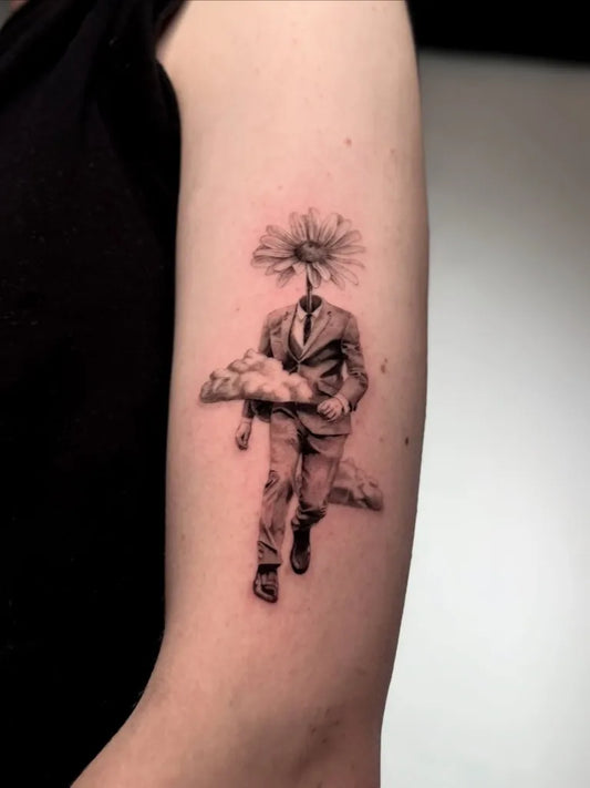 Small Blackwork Headed Man with Cloud Tattoo on Women Arm by @tattoo.by.anton