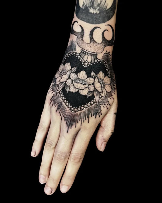 Small Blackwork Heart Flowers on Women Hand Tattoo by @needle.mistress