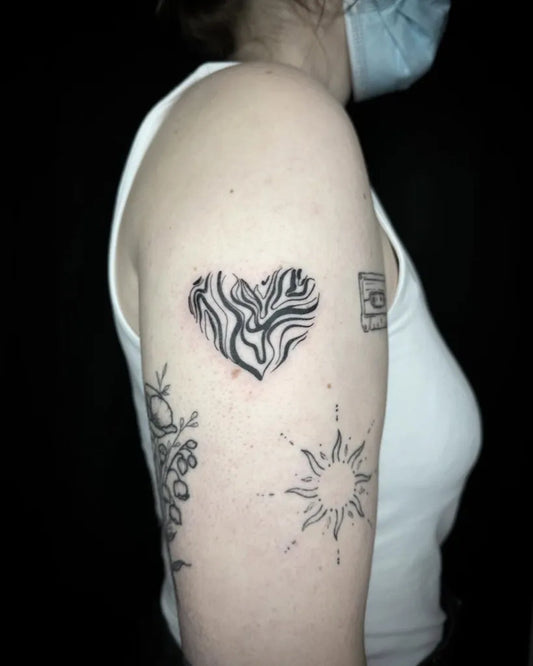 Small Blackwork Heart and Sun on Women Upper Arm Tattoo by @_lns_small_ones_