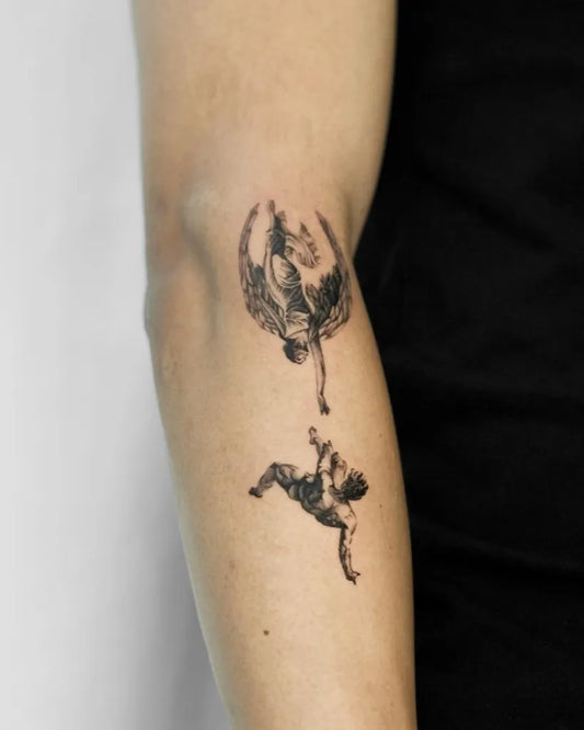 Small Blackwork Icarus and Wings on Women Arm Tattoo by @moowoai_tt