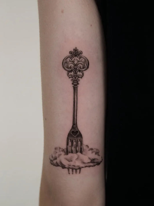 Small Blackwork Key and Fork with Cloud Tattoo on Women Arm by @kas.inks