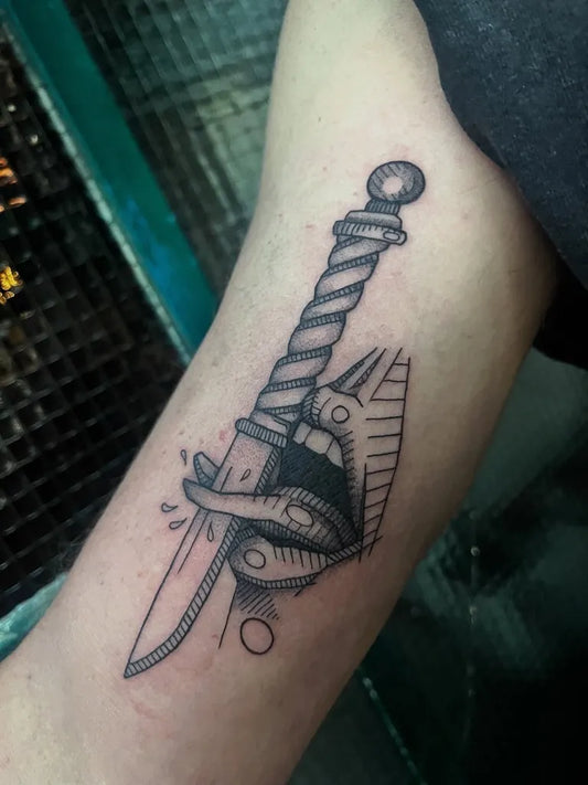 Small Blackwork Knife Lips Tattoo on Women Arm by @schat_tattoo