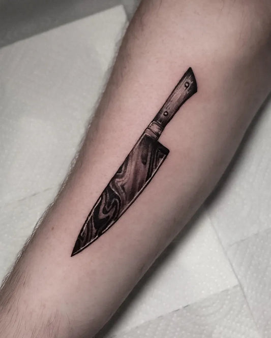 Small Blackwork Knife Tattoo on Men Arm by @kittisaktattoo