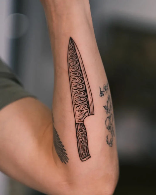 Small Blackwork Knife Tattoo on Men Arm by @nanakidme