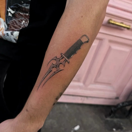 Small Blackwork Knife Tattoo on Men Arm by @poutz_tattoo
